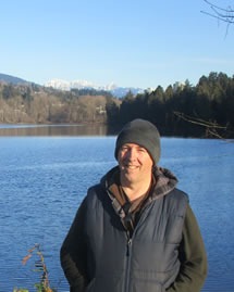 Portrait of Michael, outdoors by a lake